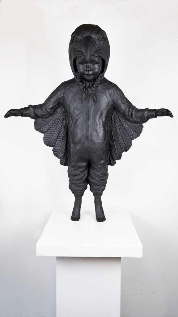 Hannes Verhoeven, "Learning to Fly," resin, 95 cm — child in an eagle costume with wings spread, larger resin edition